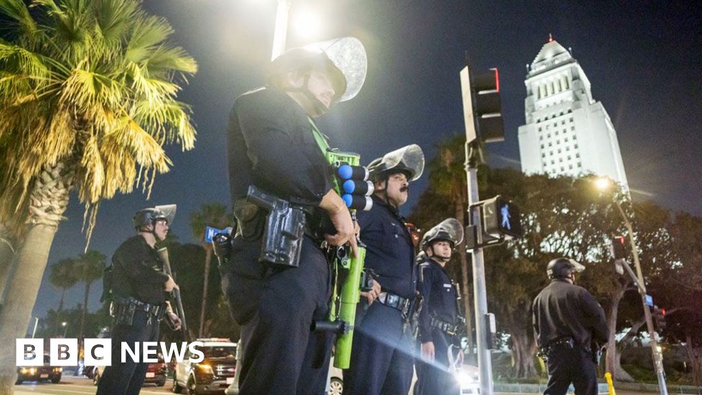 LA police enforce curfew as Trump vows to 'liberate' city