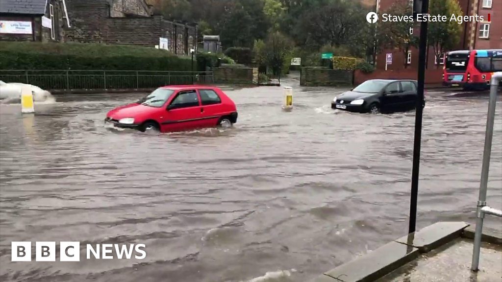 Drivers battle through flooded roads