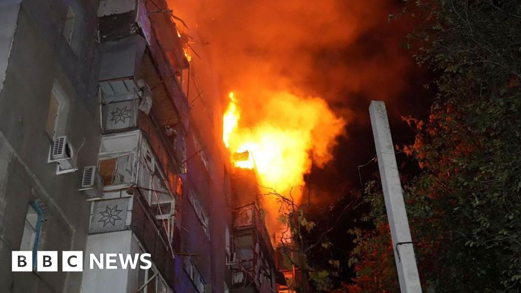 Buildings burn as another wave of Russian attacks hits Ukraine