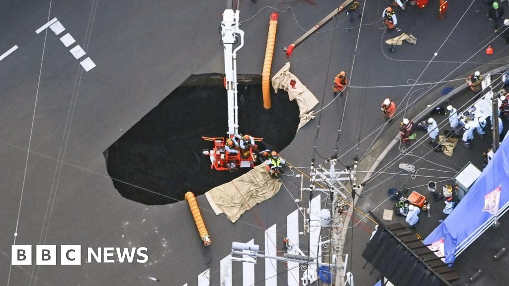 Massive Sinkhole in Japan Traps Driver, Rescue Efforts Underway