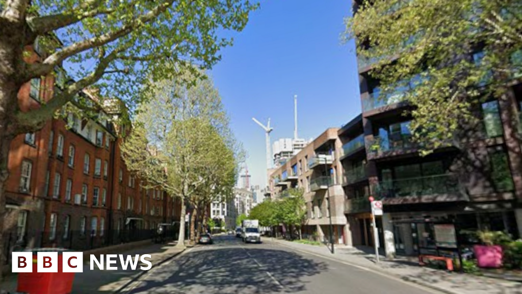 Murder charge over woman's body found at property