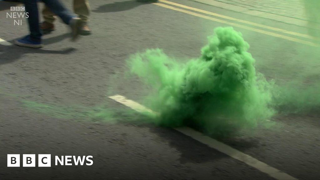 Smoke bombs thrown at Belfast protests BBC News