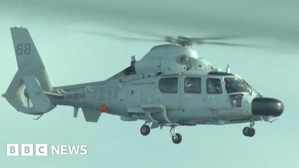 Chinese navy helicopter flies close to Philippine plane