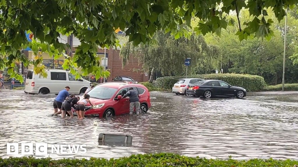 Guildford: Cars stranded after storms bring floods