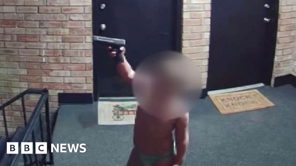 Man arrested on US TV after toddler filmed waving gun