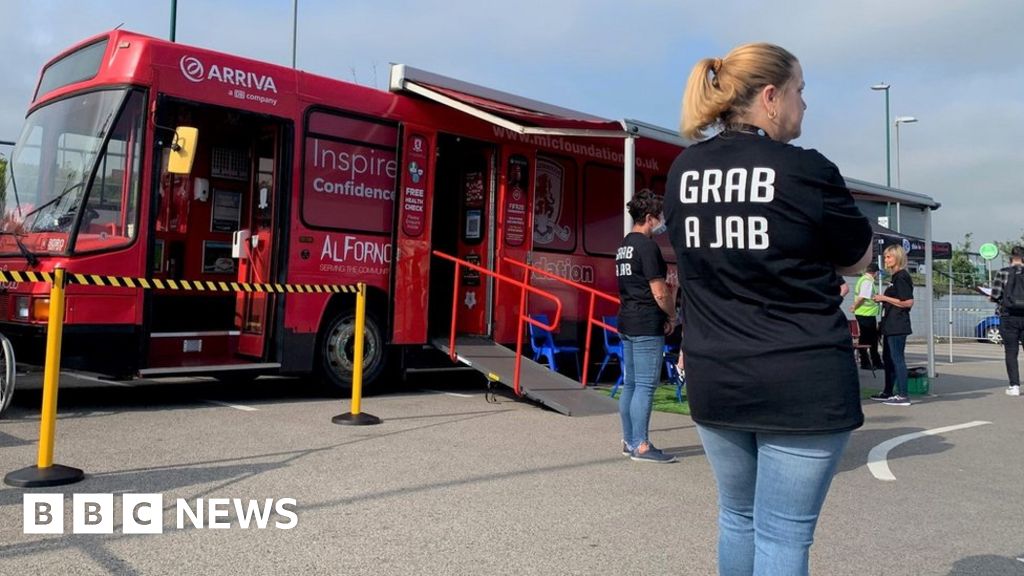 Middlesbrough FC bus turned into a pop-up Covid jab centre - BBC News