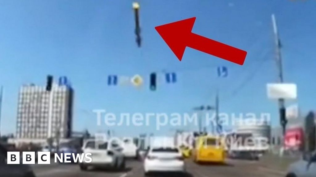 Ukraine war: Dashcam captures moment missile debris falls onto Kyiv road