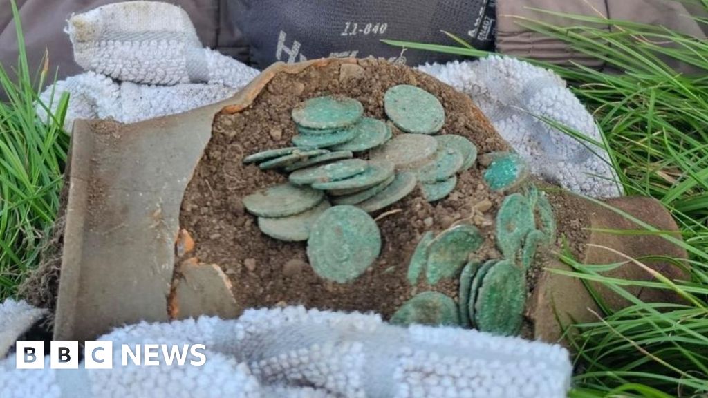 Detectorist Uncovers Potentially Largest Roman Coin Hoard in Wales