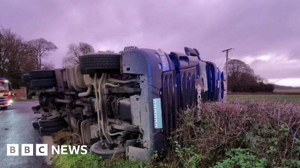 Dorset: Driver arrested after lorry overturns at Winterborne Zelston 