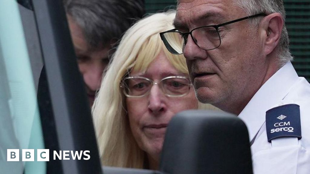 Joanna Rowland-Stuart being put in a court van.