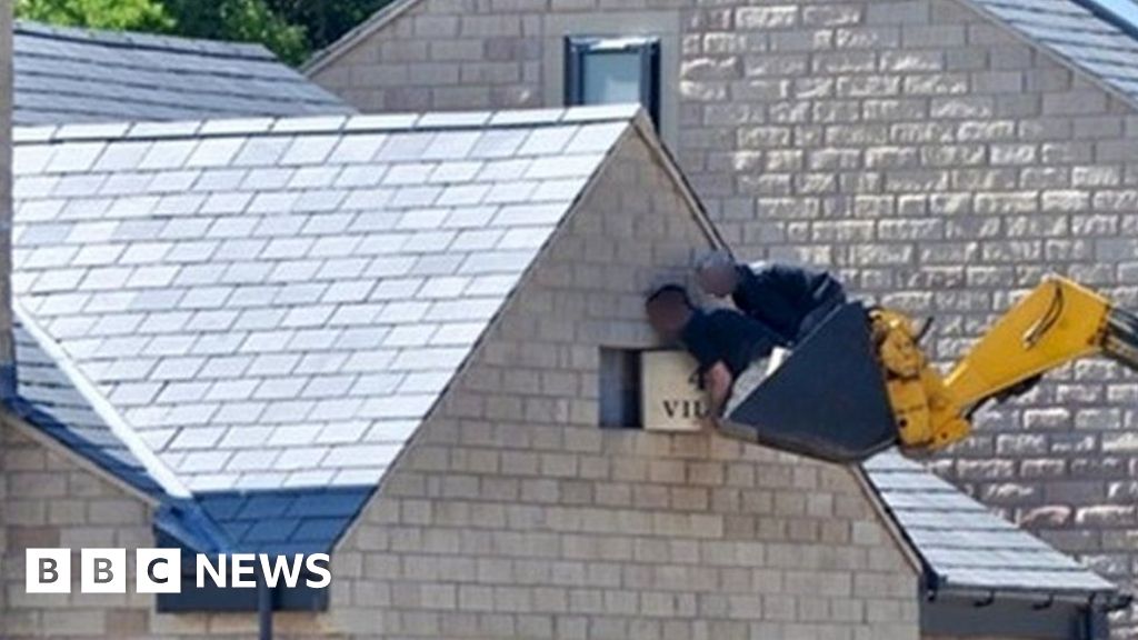 Firm fined £120k after builders lifted in digger's bucket