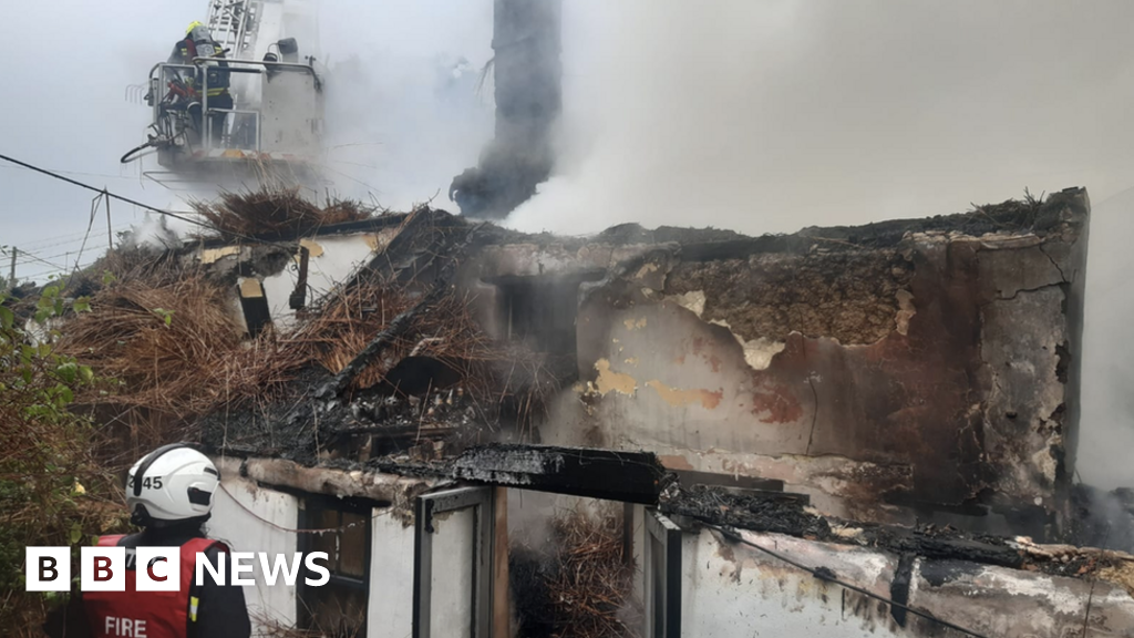 Sixty firefighters sent to Devon thatch cottage fire BBC News