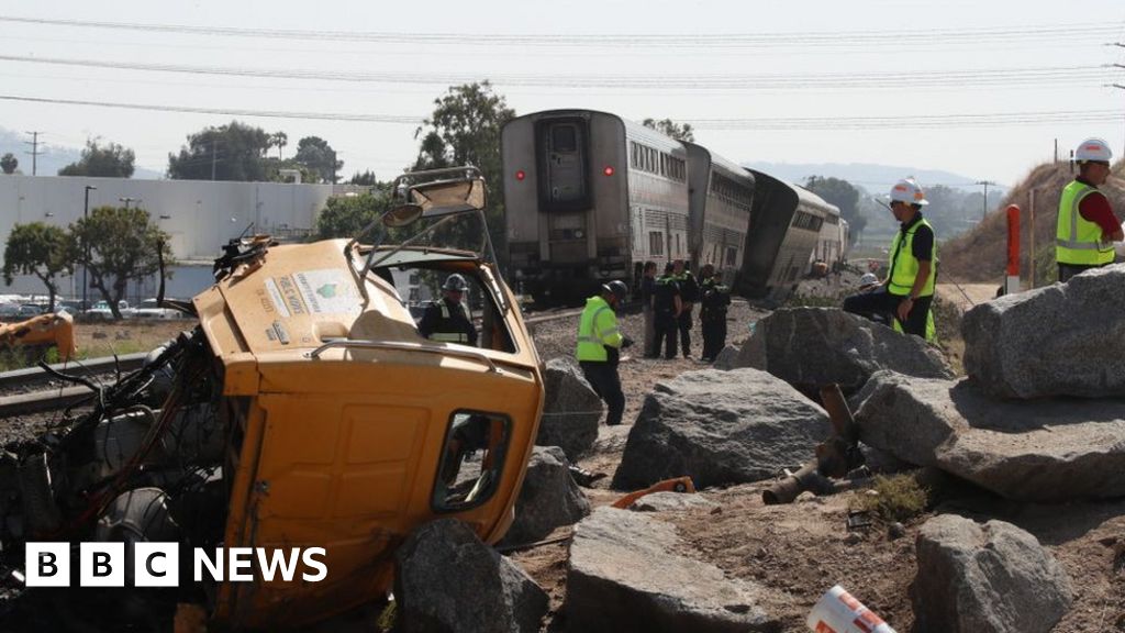 Passenger Amtrak train derails after hitting truck in California