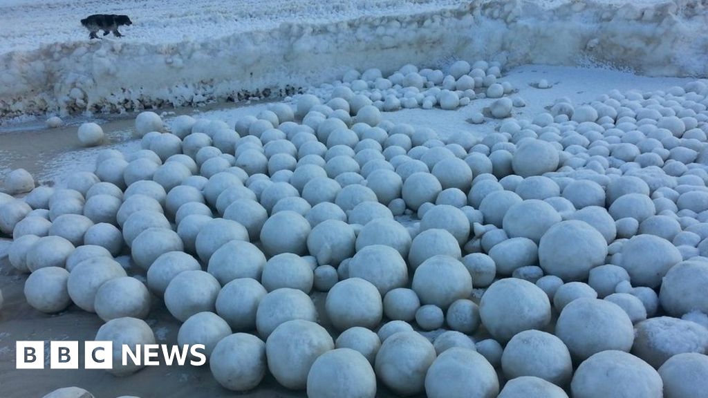 Photographer Captures Picture of Stunning 'Ice Ball' Phenomenon on Finnish  Beach