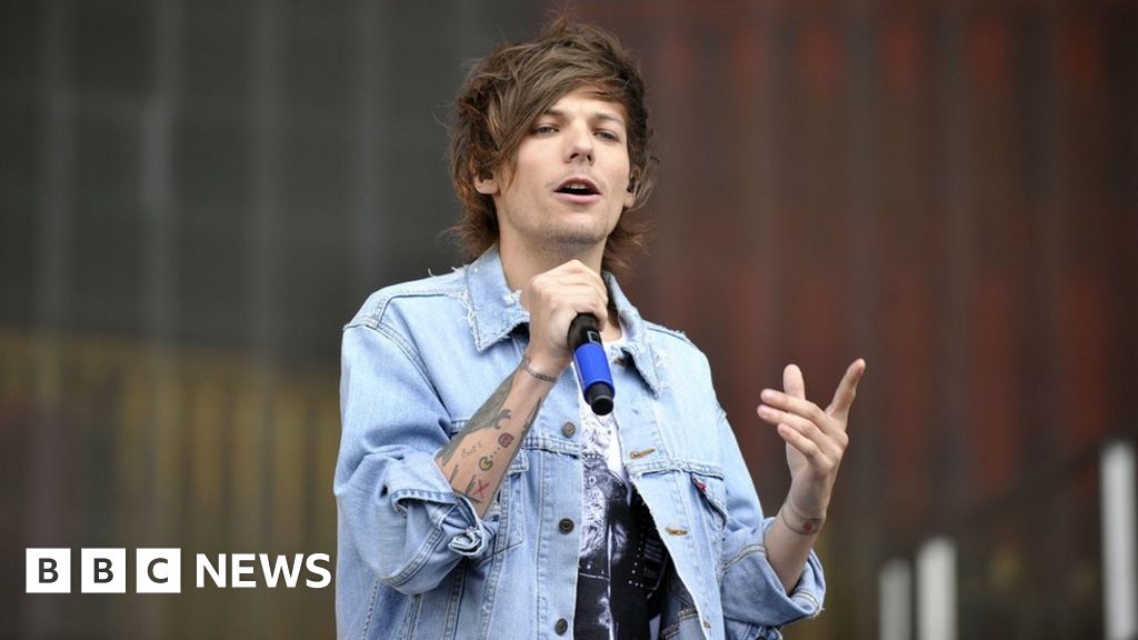 New dad Louis Tomlinson pictured 'drinking under age and