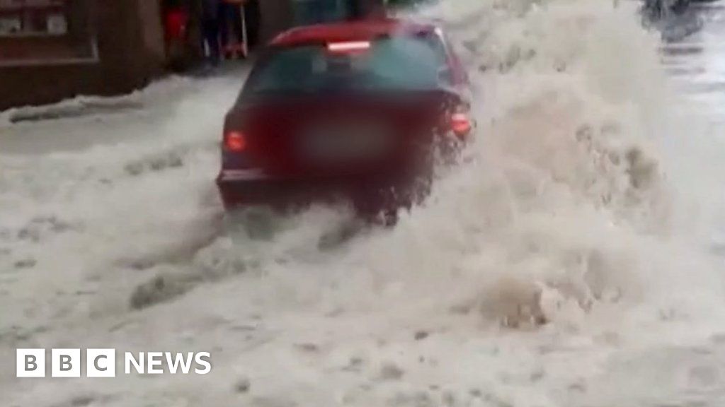 Car swept backwards in raging Spanish floodwaters
