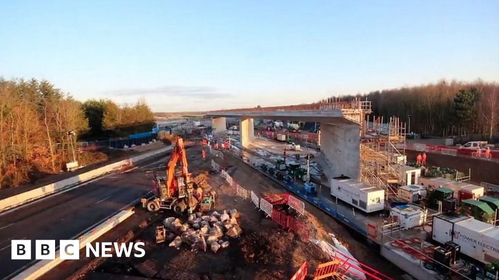 Giant HS2 bridge guided into position over M42 - BBC News