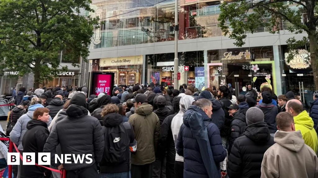 Massive queues shut Swatch stores as hundreds clamour for £335 limited edition watch