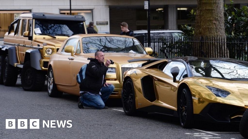 gold car aventador