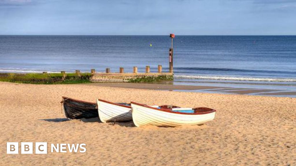 Knife attacker search after woman killed on beach