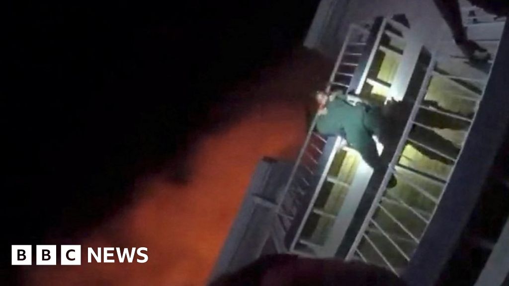 A dangling baby's breath-taking escape from a fire