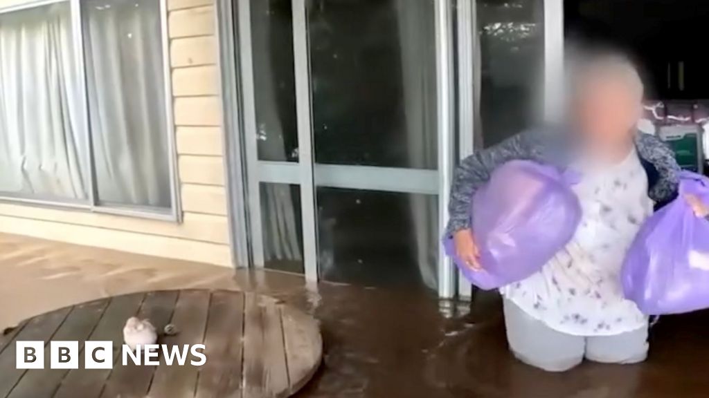 Watch: Elderly woman rescued from floodwaters in Australia