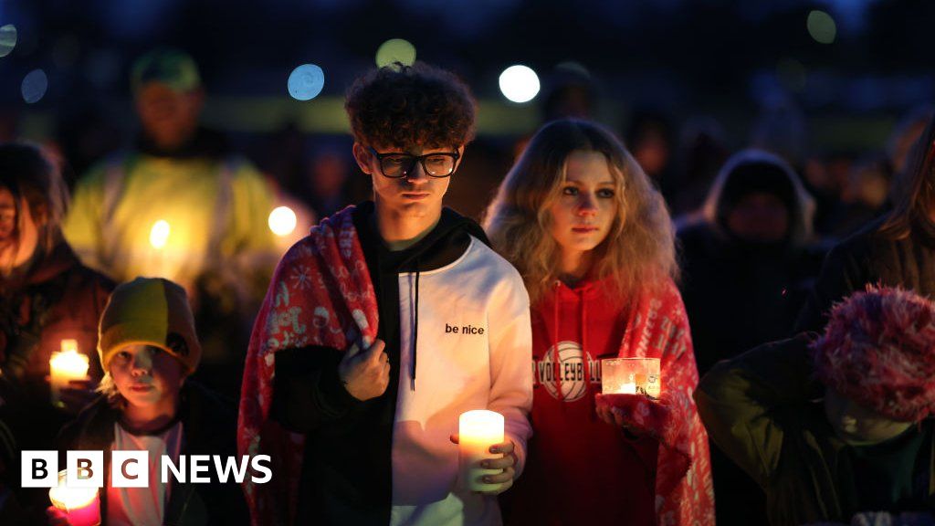 Iowa school principal distracted gunman before being shot