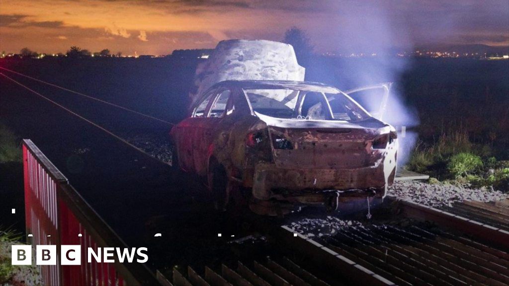 Car on train tracks 'a deliberate and reckless attack' BBC News