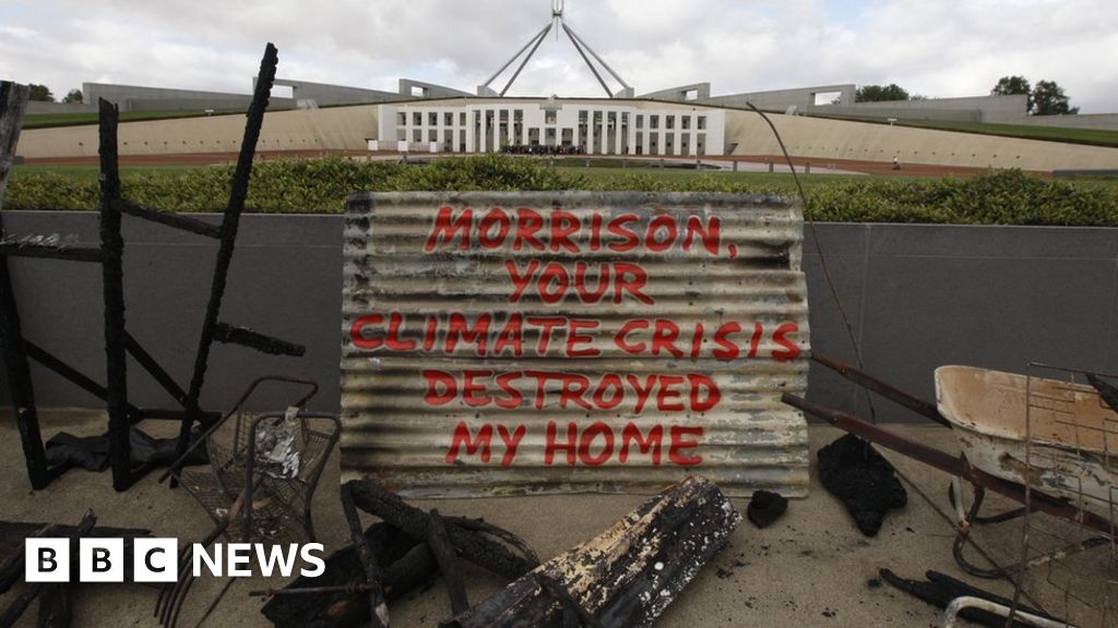 Australia bushfires: Woman places remains of home outside parliament