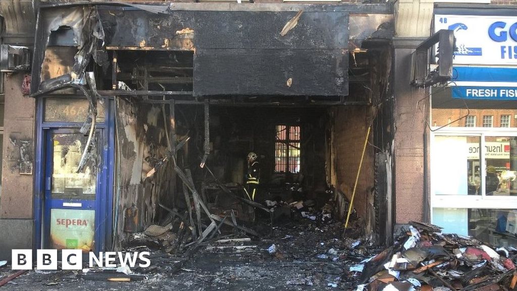 Driver flees after car smashes into Harrow shop and bursts into flames ...