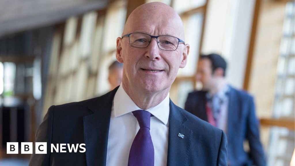 How did Swinney persuade opposition parties to back his budget?