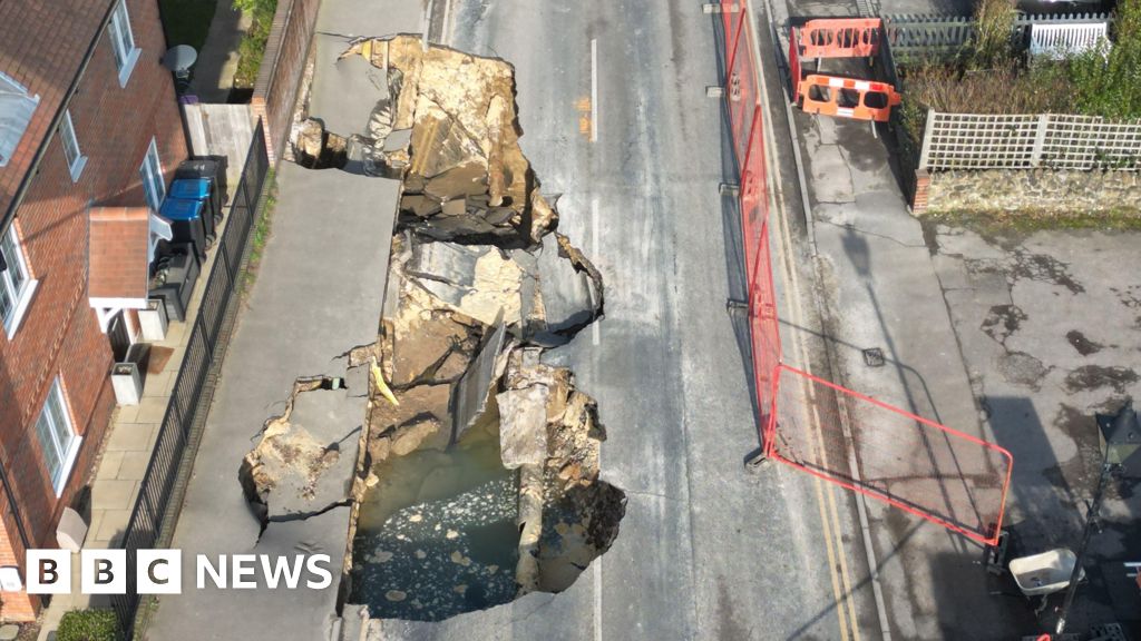 Families evacuated as 'terrifying' sinkhole appears