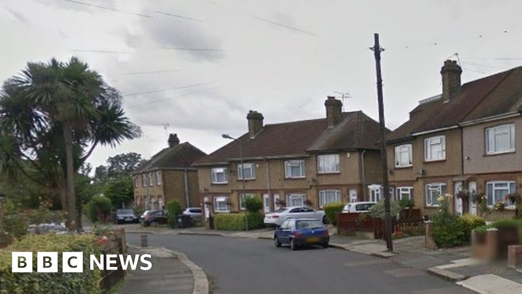 Woman charged after child's remains found in London home - BBC News