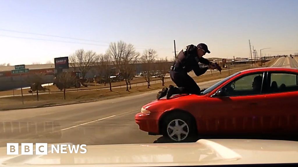 Officer clings to roof in wild Iowa car chase