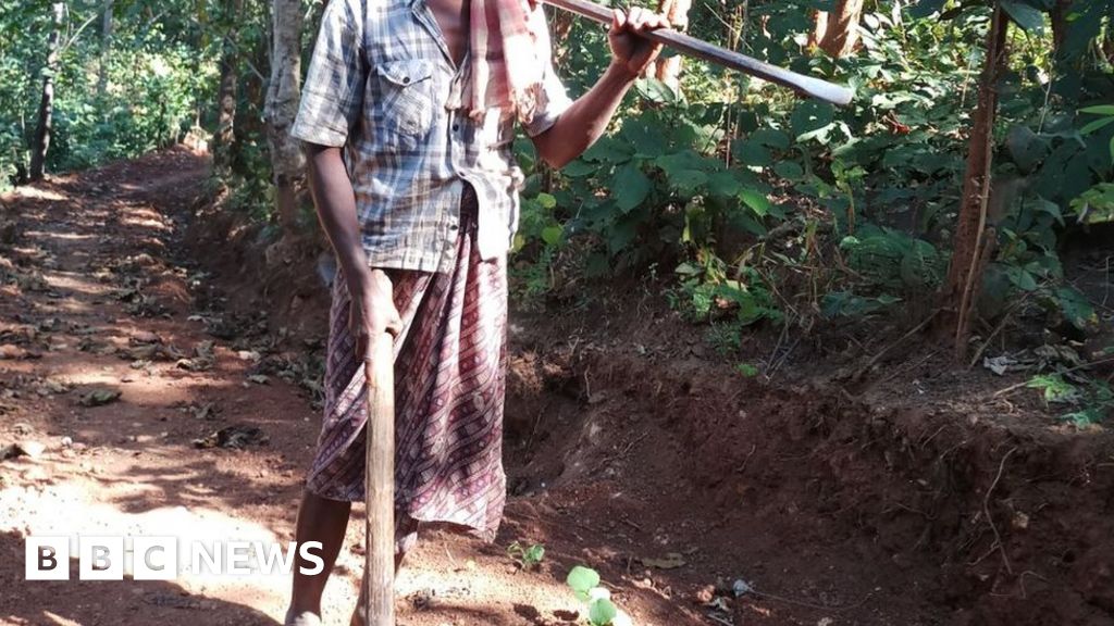 Man builds road to village with pick axe