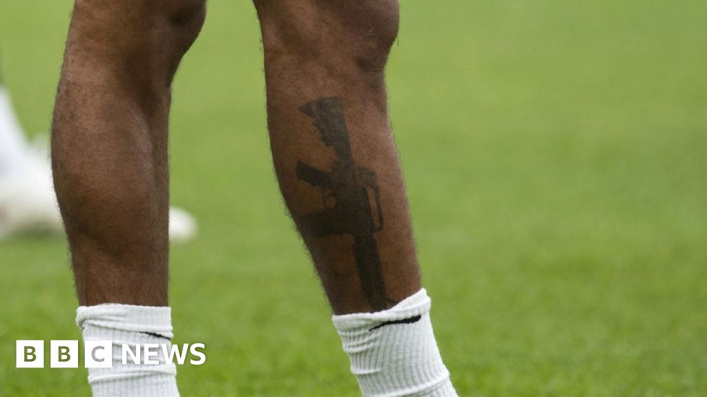 England forward Raheem Sterling defends gun tattoo - BBC News