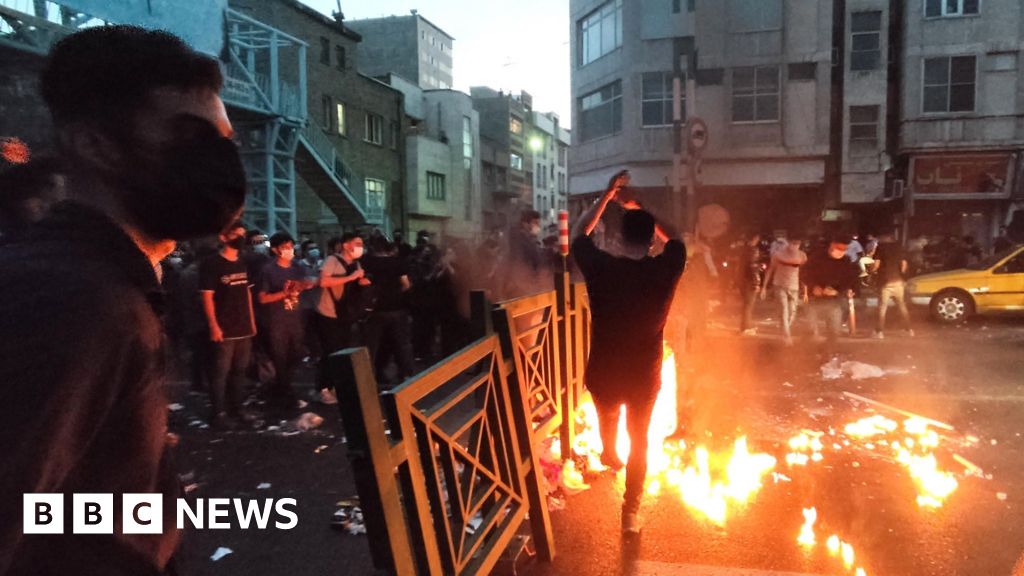 Iran police battle protesters in Tehran as unrest over woman's death spirals