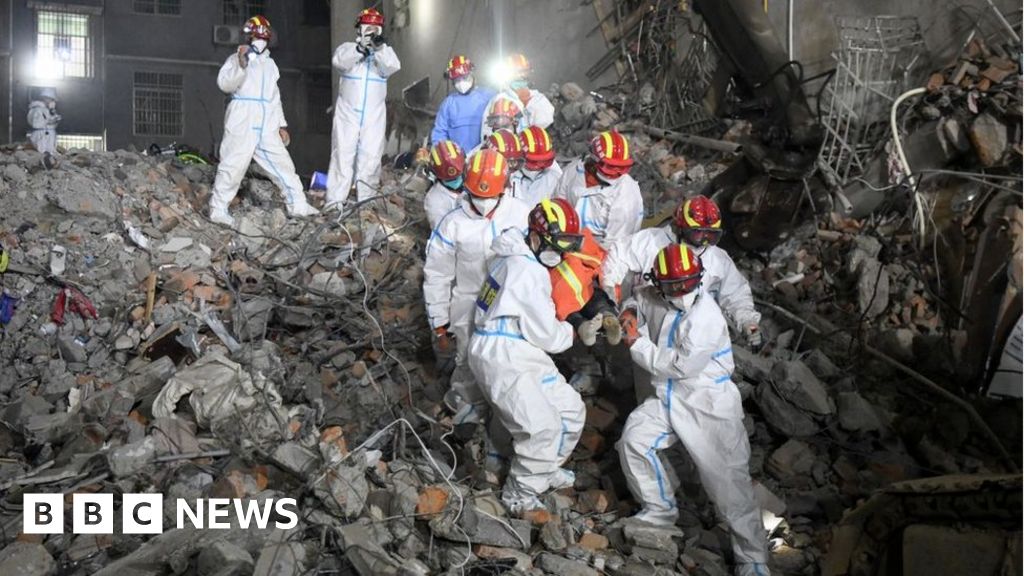 China building collapse: Woman rescued from rubble after six days