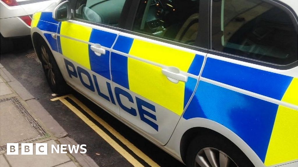 Police and security cars park on double yellow lines outside Bristol ...