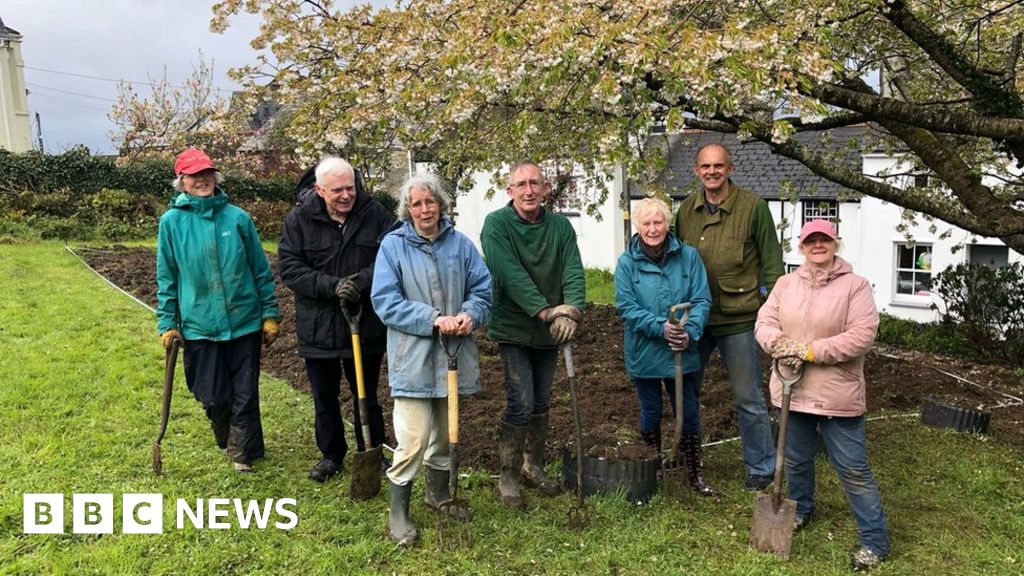 Volunteers planting vegetable patch in Landrake graveyard