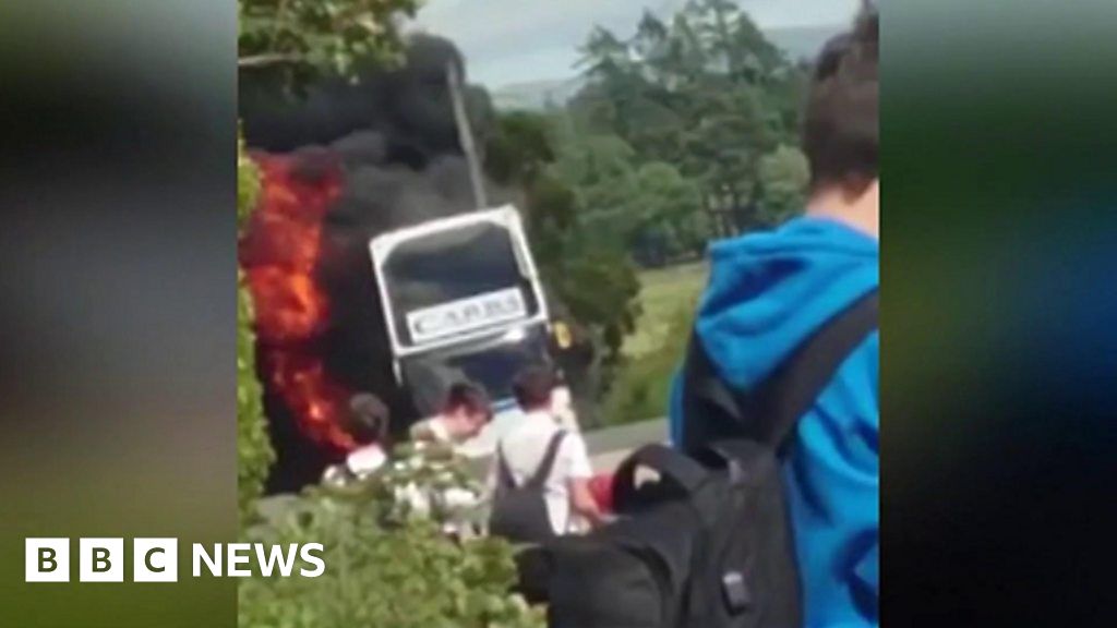 School bus engulfed in flames - BBC News