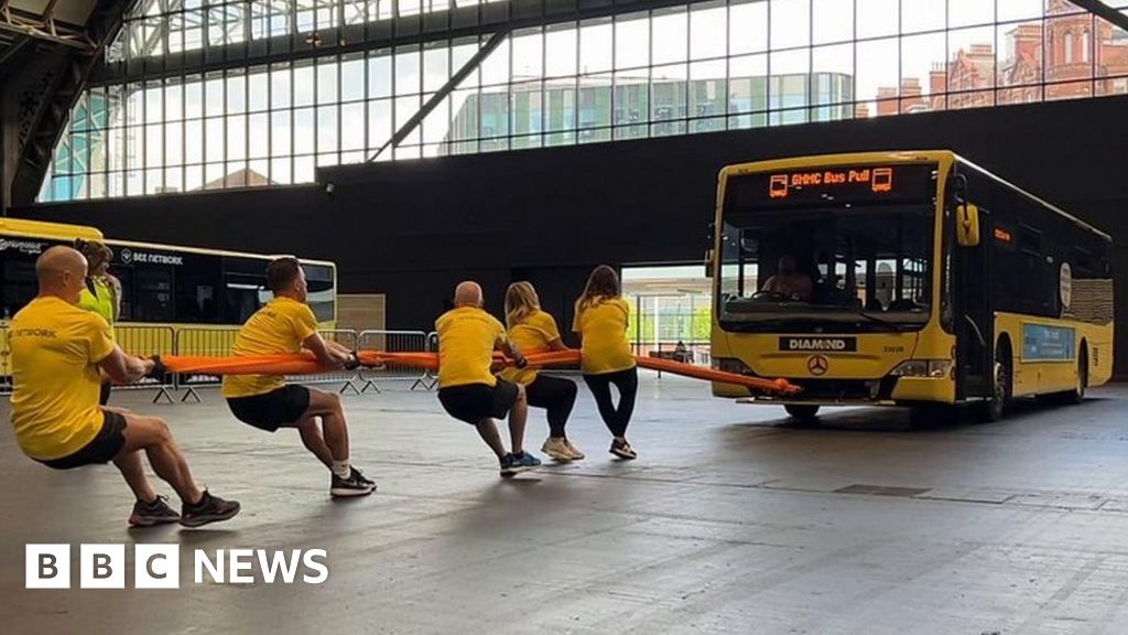 Charity buspulling to help the homeless in Greater Manchester BBC News