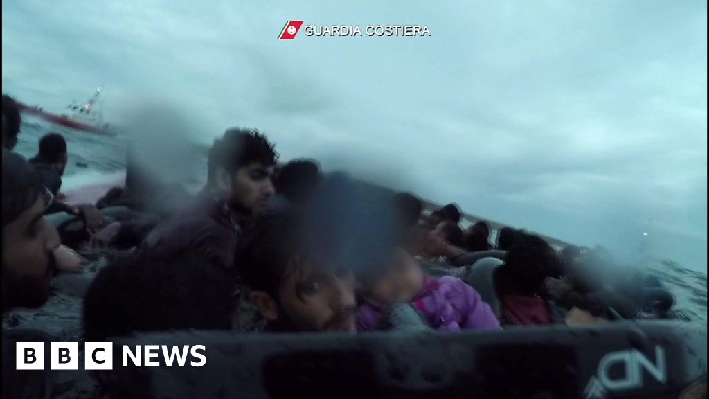 Italian coastguard rescues child migrant from the sea