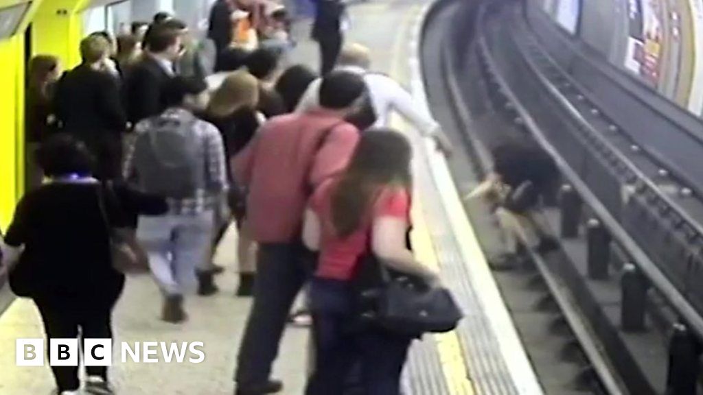 Football fan jailed for pushing man on to Tube track BBC News