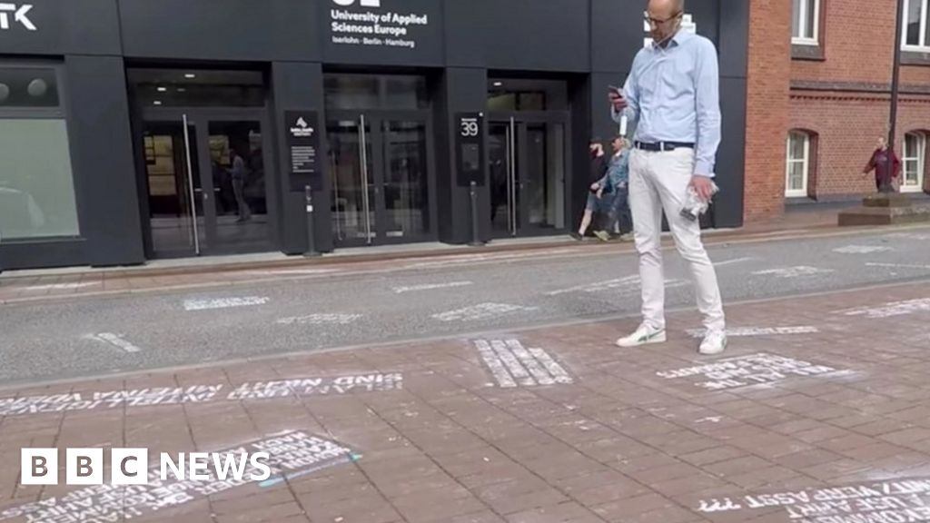 'Hate speech' tweets painted at Twitter HQ in protest - BBC News