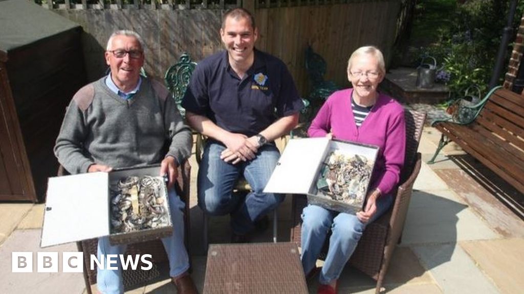 Couple reunited with stolen items found in pond after 11 years - BBC News