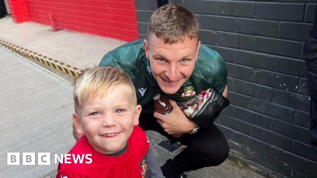 Cerebral palsy: Wrexham boy gets first football boots