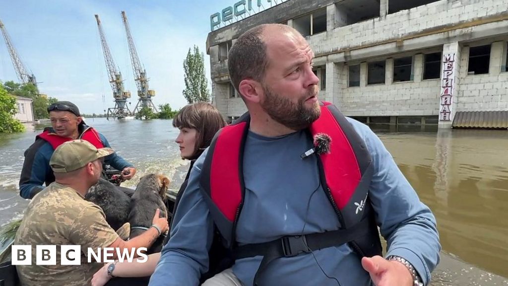 Ukraine dam: View from a boat on what used to be a street