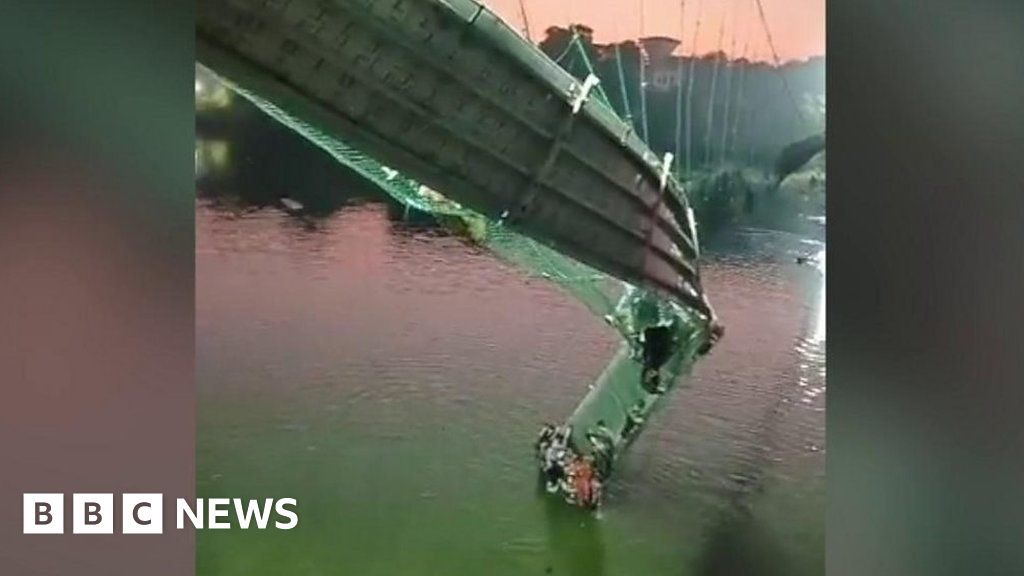 People climb up collapsed Gujarat bridge to escape river