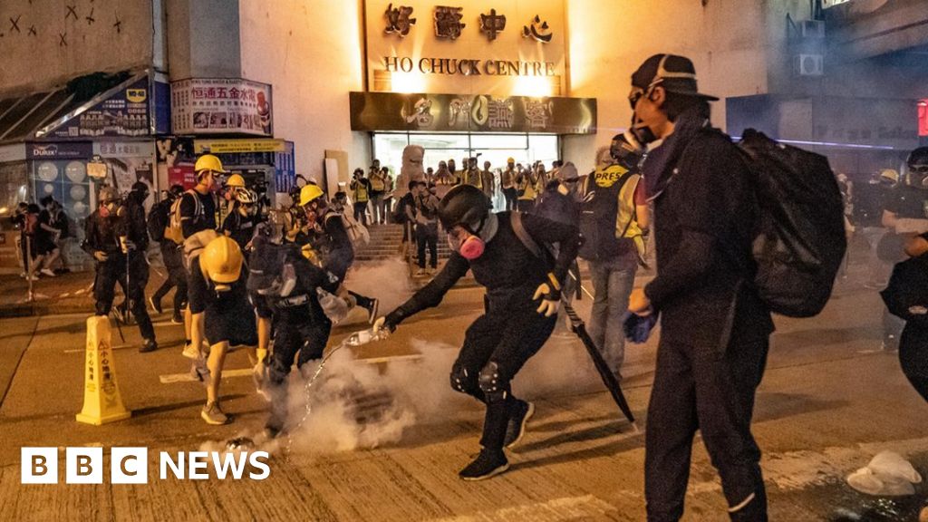 Hong Kong protests: Clashes as police fire tear gas into rail station